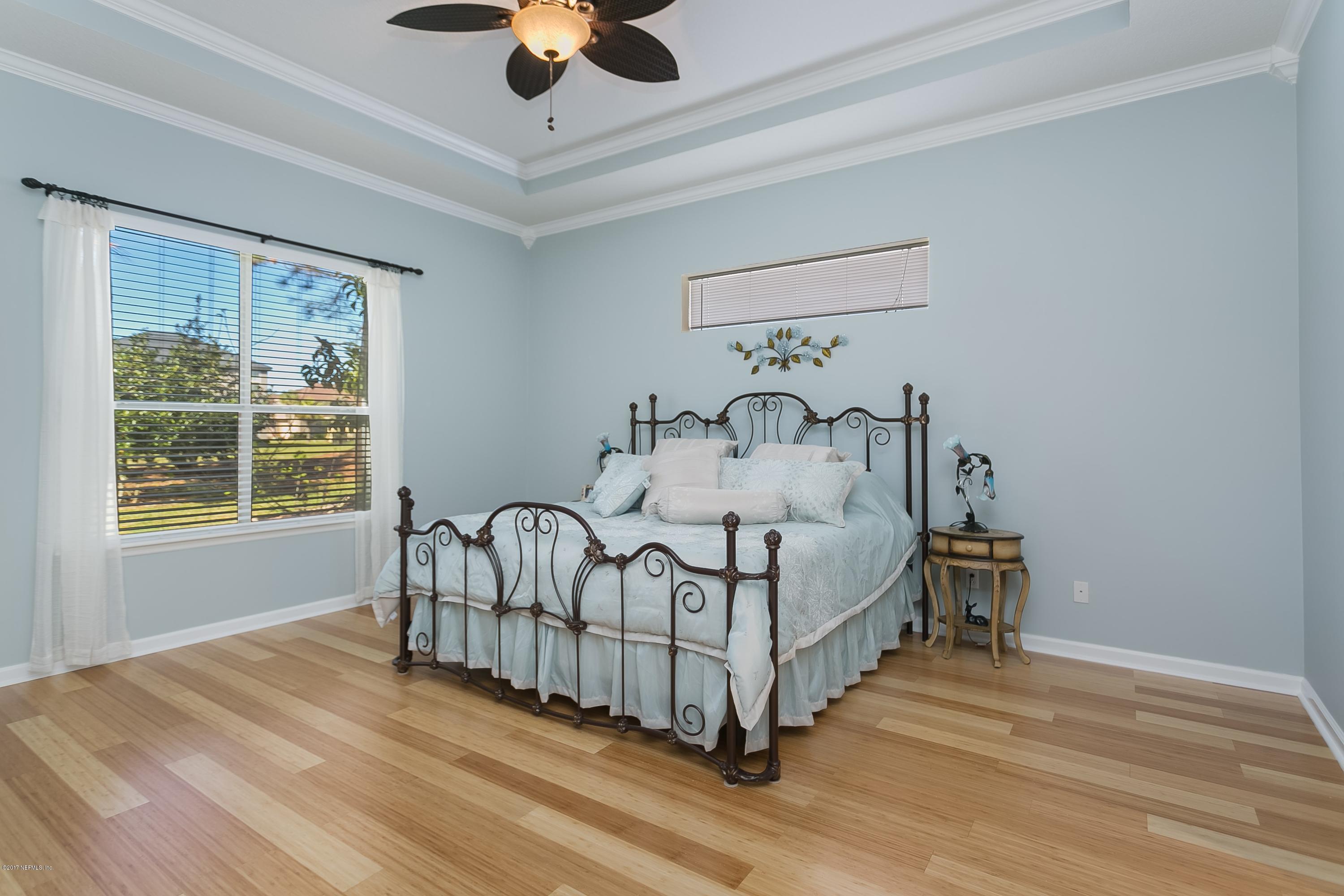 660 Porta Rosa Circle St. Augustine, FL 32092 - Photo 13 of 32 a bedroom with a bed and a window