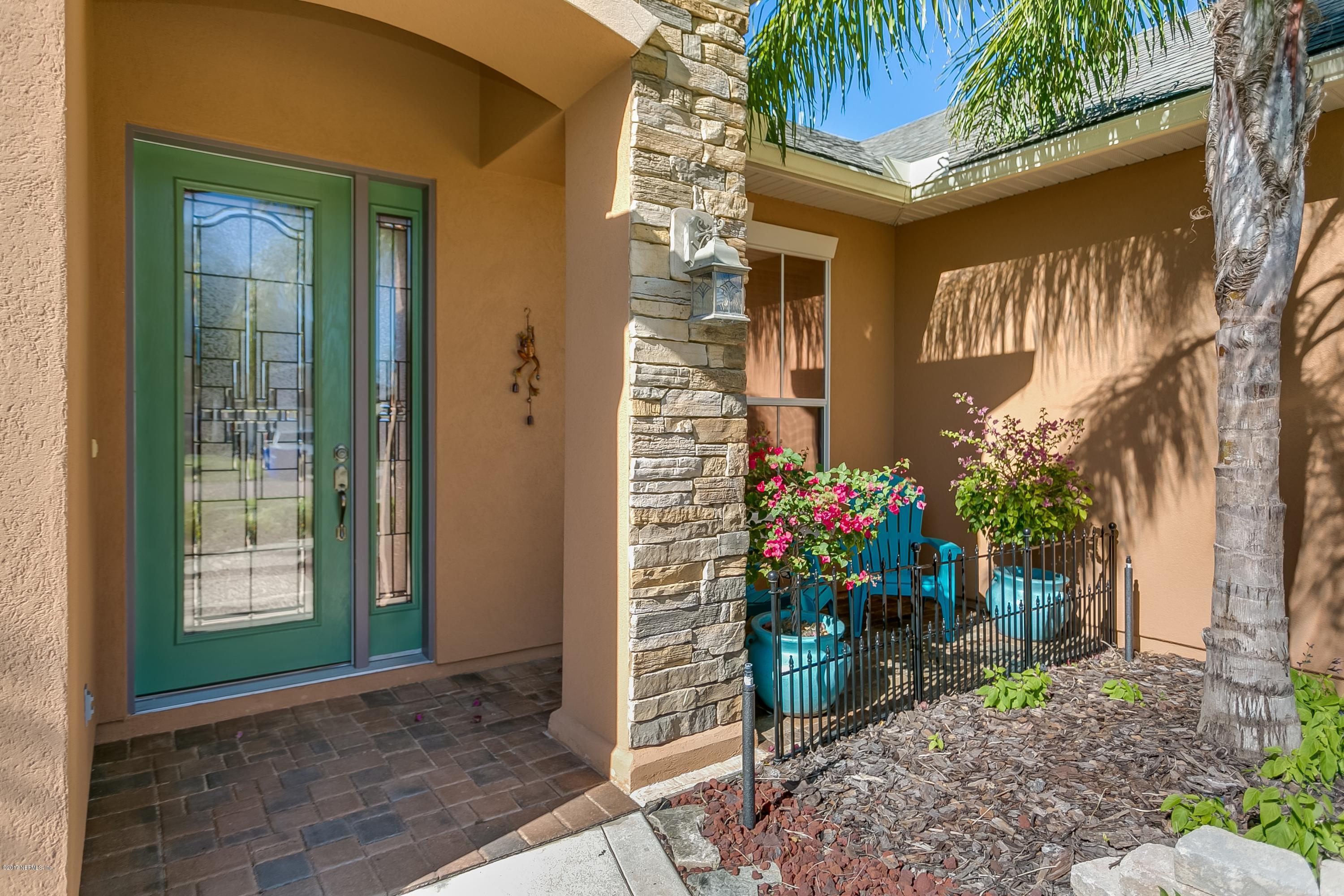 660 Porta Rosa Circle St. Augustine, FL 32092 - Photo 2 of 32 a front view of a house with a porch