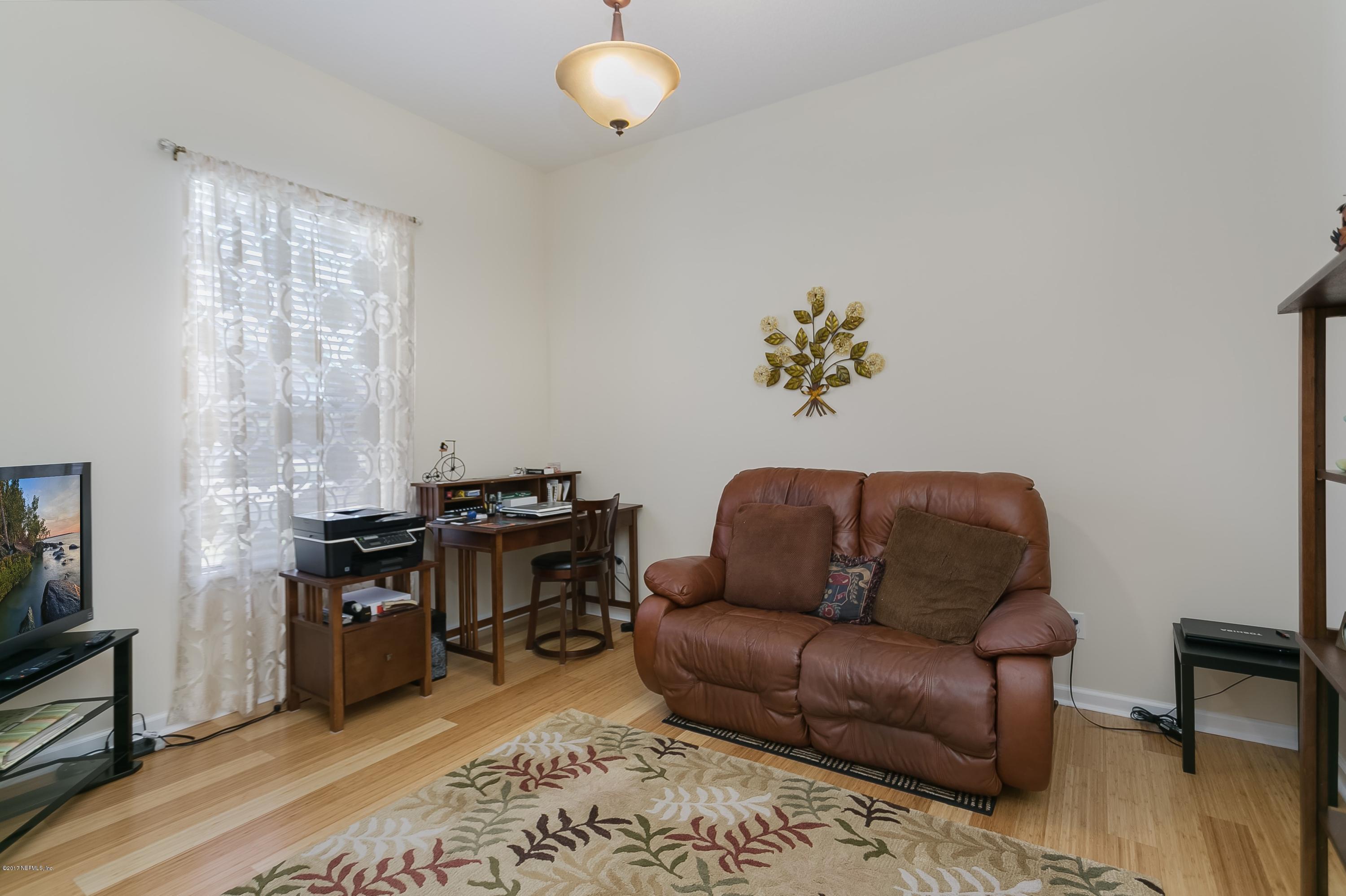 660 Porta Rosa Circle St. Augustine, FL 32092 - Photo 5 of 32 a living room with furniture rug and window