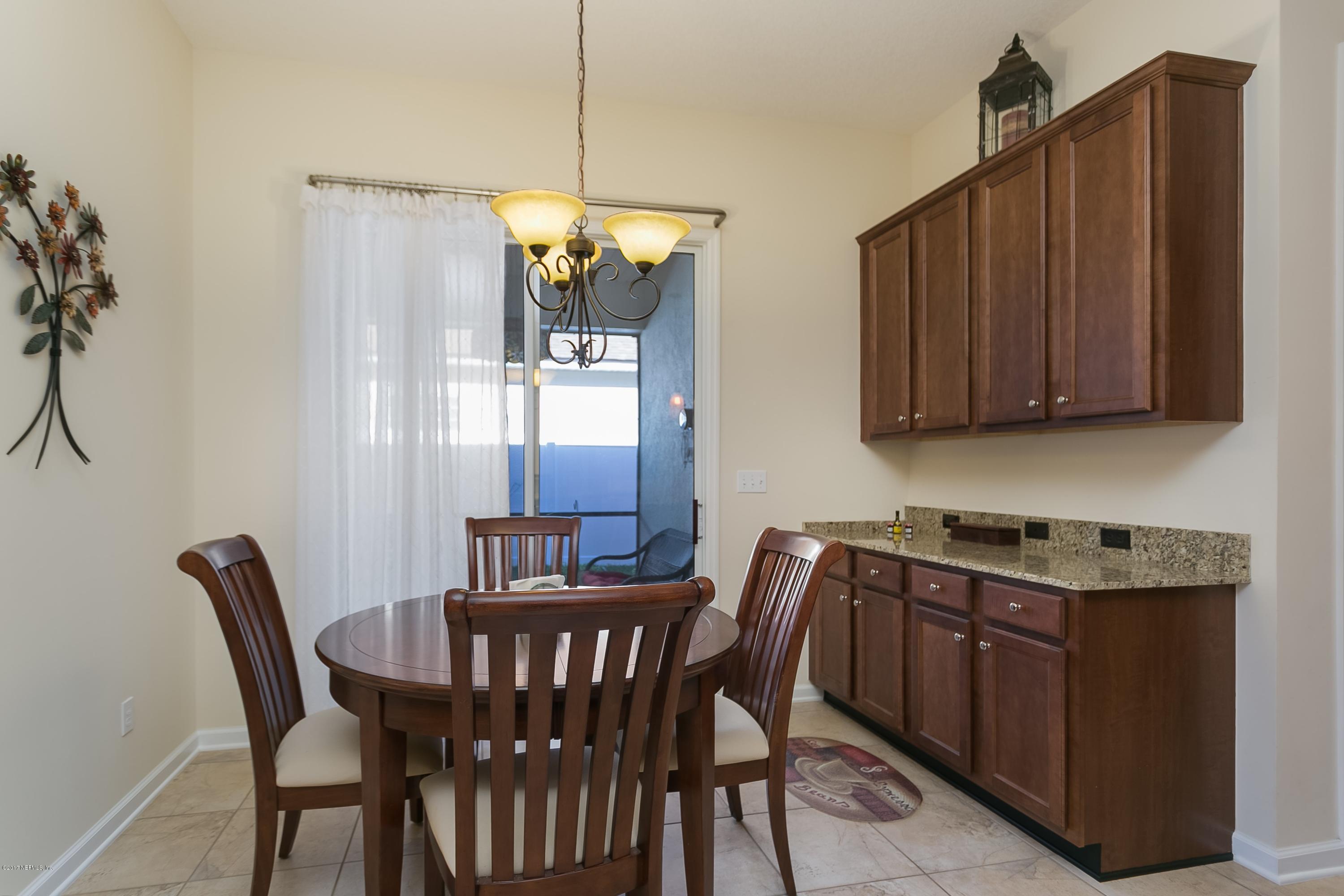 660 Porta Rosa Circle St. Augustine, FL 32092 - Photo 9 of 32 a view of a dining room with furniture window and wooden floor
