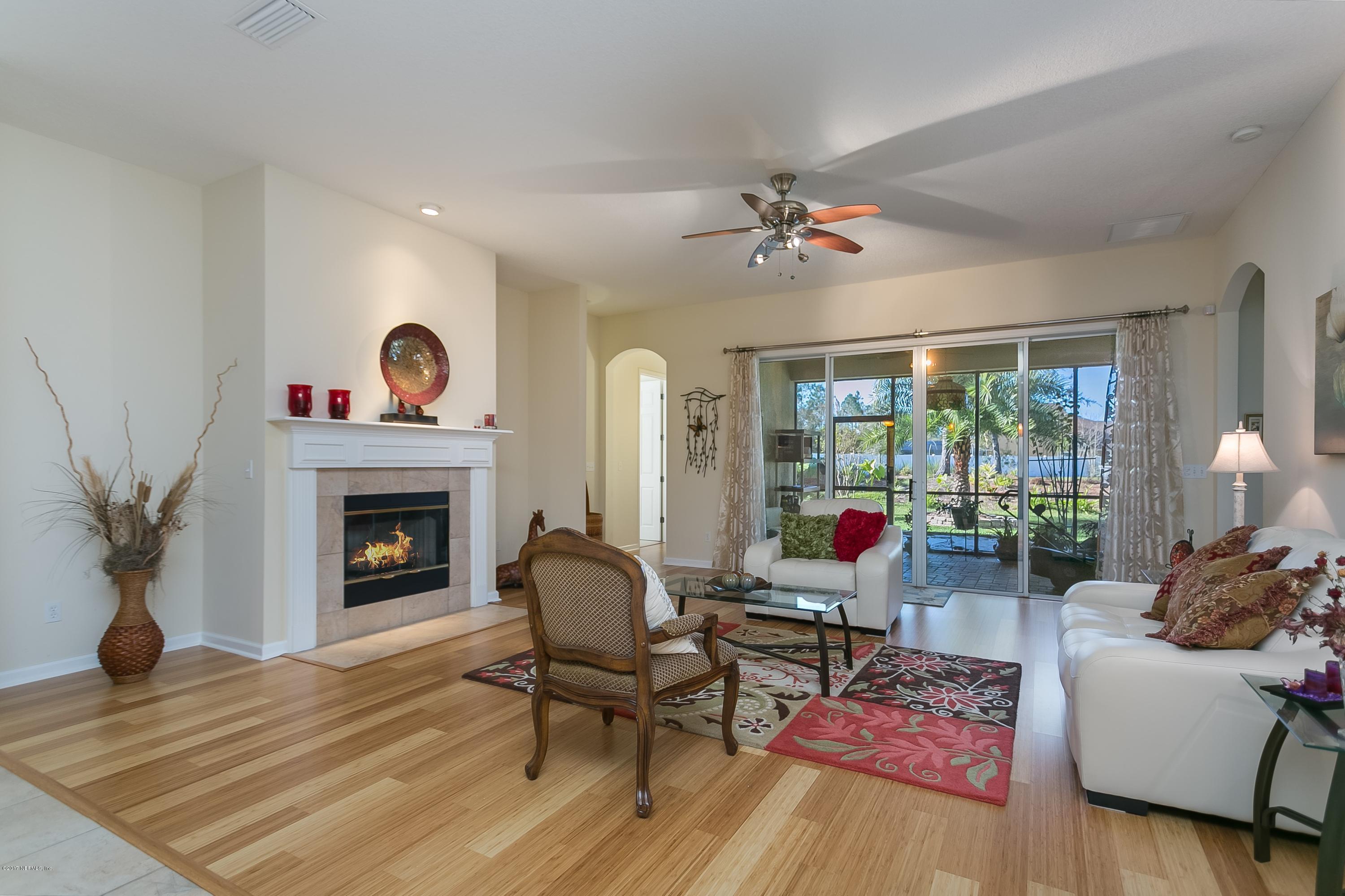 660 Porta Rosa Circle St. Augustine, FL 32092 - Photo 10 of 32 a living room with furniture and a fireplace