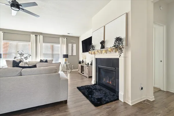 a living room with furniture and a fireplace