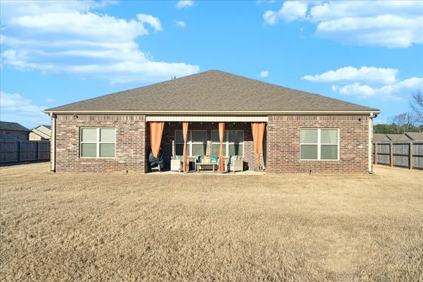 front view of a house with a large window
