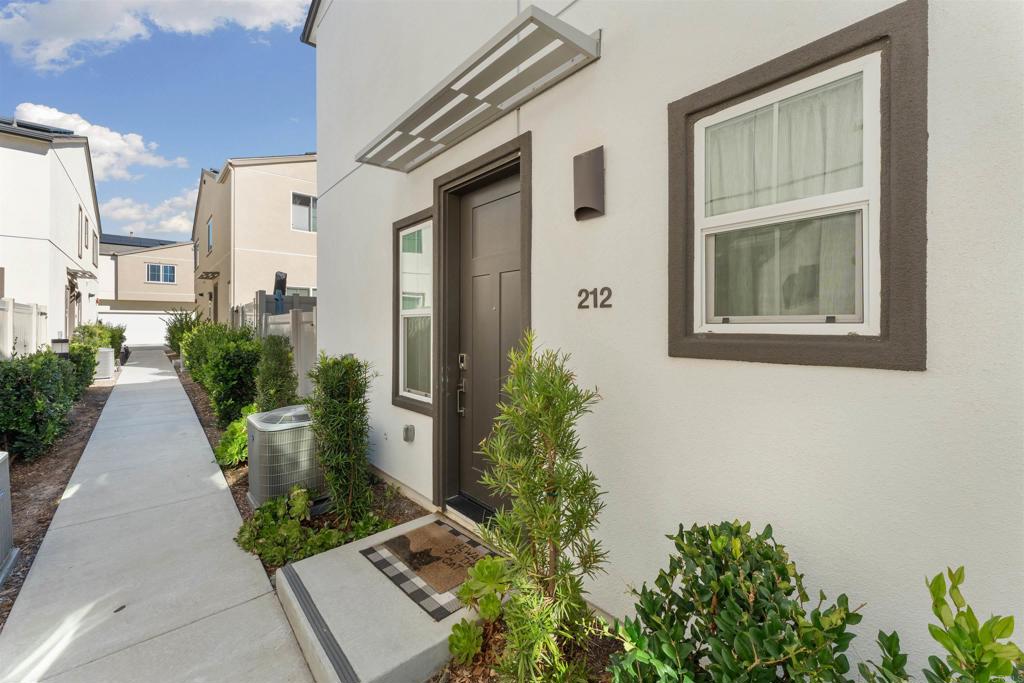 212 Perennial Place Fallbrook, CA 92028 - Photo 34 of 39 a view of a front door and potted plants