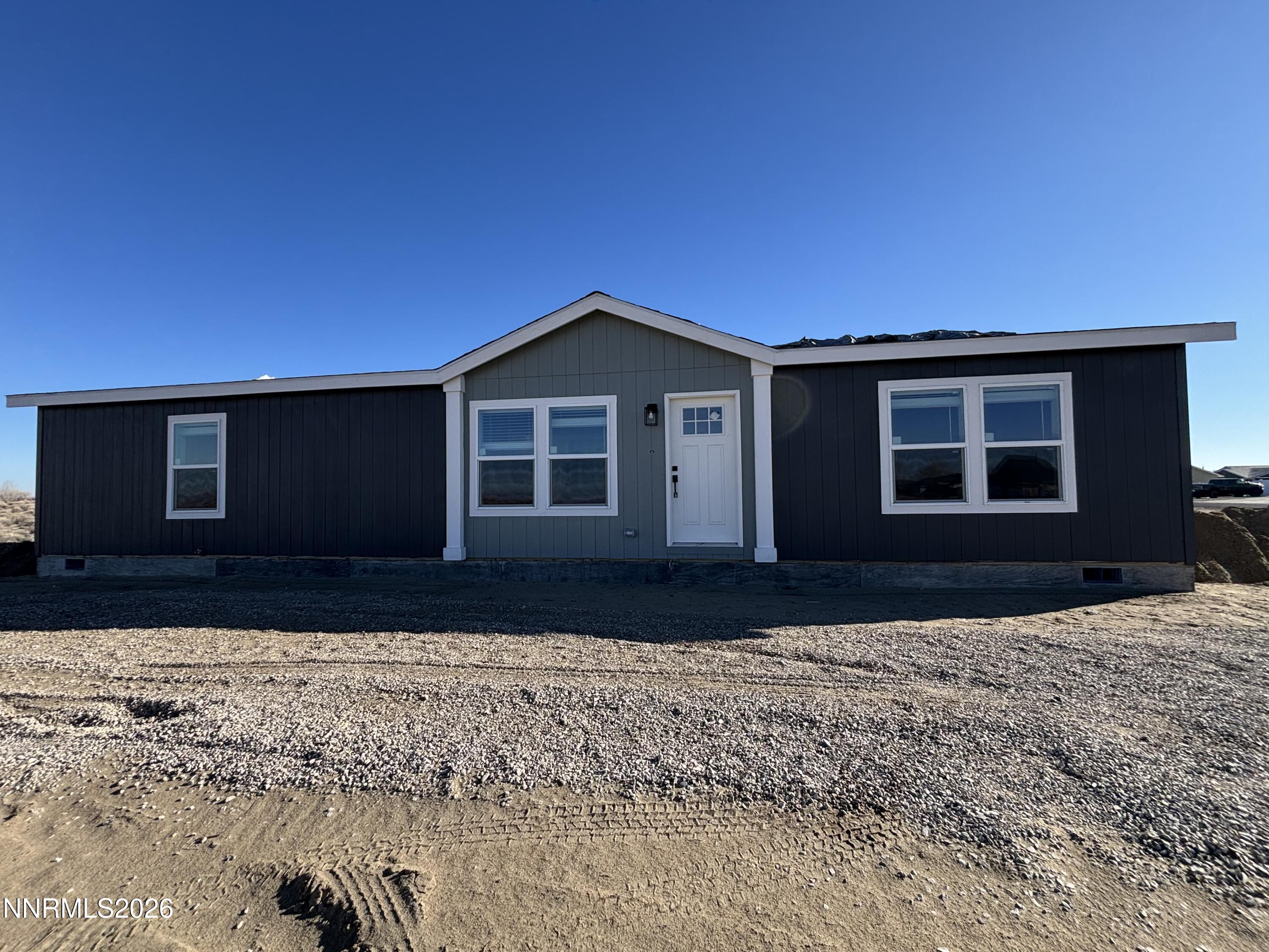 5574 Dillon Drive Fallon, NV 89406 - Photo 1 of 1 a front view of a house with a yard