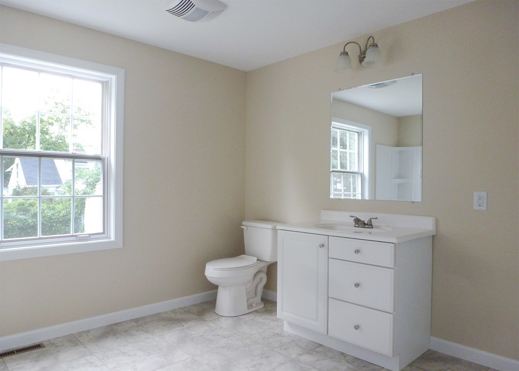 184 Ellsworth Avenue Springfield, MA 01118 - Photo 11 of 25 a spacious bathroom with a toilet sink and window