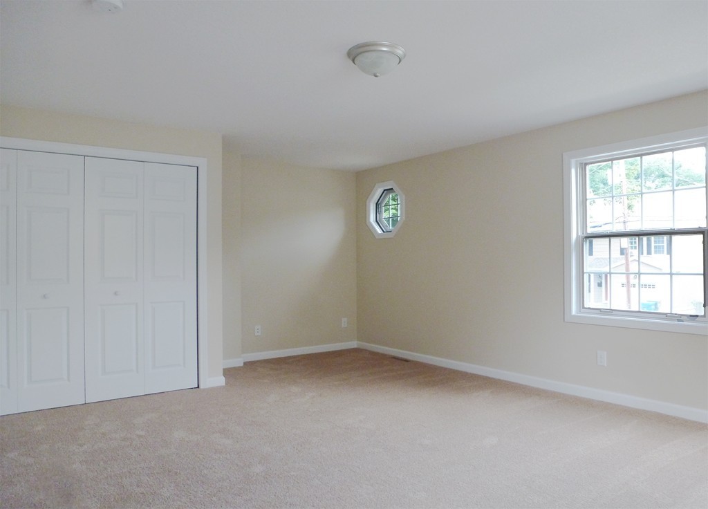 184 Ellsworth Avenue Springfield, MA 01118 - Photo 18 of 25 an empty room with a window