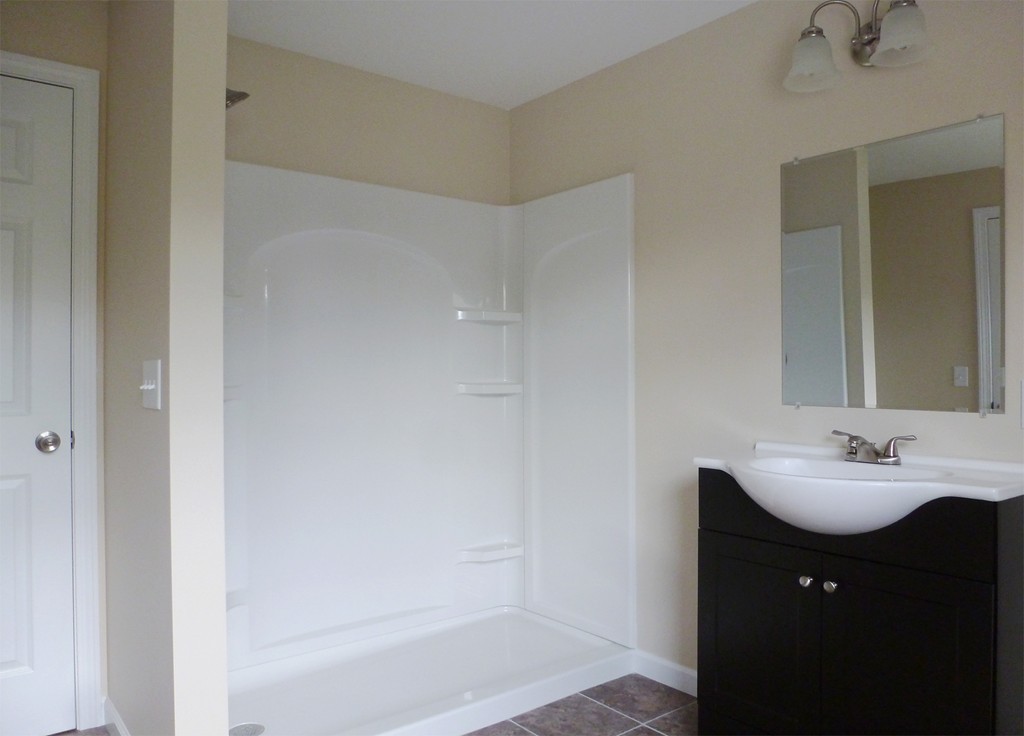 184 Ellsworth Avenue Springfield, MA 01118 - Photo 23 of 25 a bathroom with a sink and a mirror