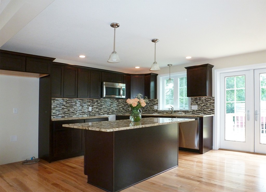 184 Ellsworth Avenue Springfield, MA 01118 - Photo 4 of 25 a kitchen with stainless steel appliances granite countertop a sink and a stove