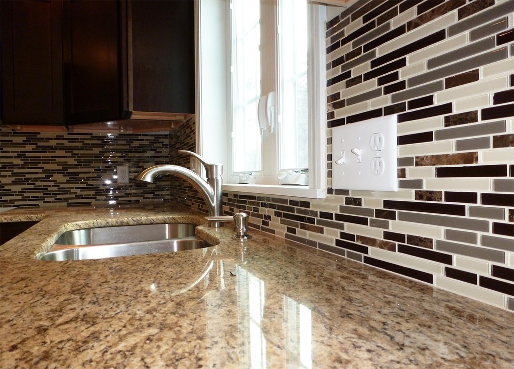 184 Ellsworth Avenue Springfield, MA 01118 - Photo 5 of 25 a kitchen with granite countertop a sink and a stove