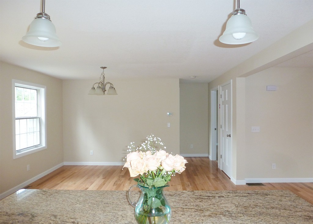 184 Ellsworth Avenue Springfield, MA 01118 - Photo 10 of 25 a view of a room with wooden floor and chandelier