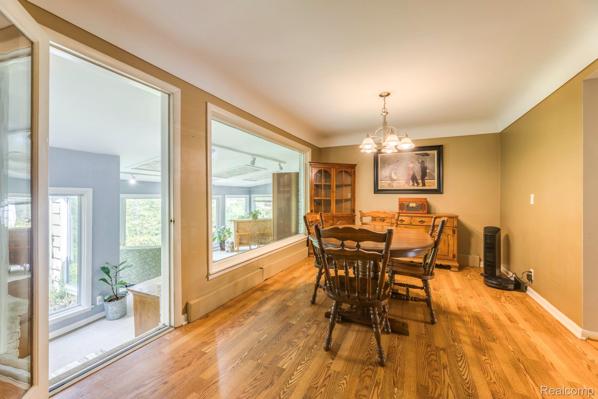 3560 North Road North Street, MI 48049 - Photo 21 of 53 Dining room with a chandelier and light wood finished floors