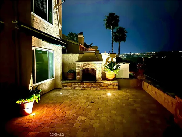 a front view of a house with a garden and yard