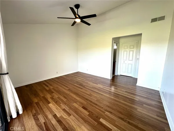 a bathroom with a granite countertop toilet and a sink