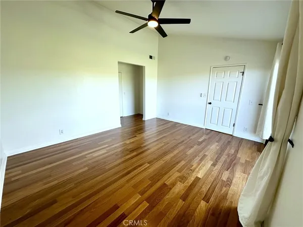 a white toilet sitting next to a bath tub