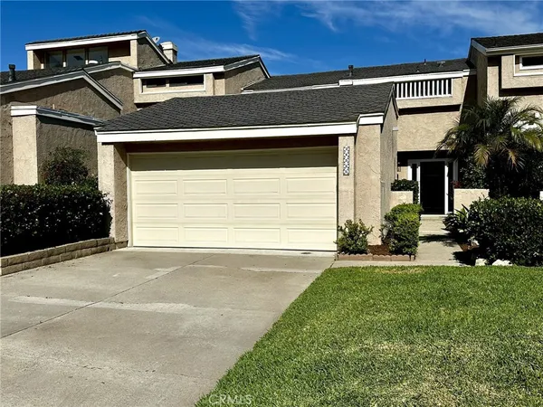 a view of empty room with a fireplace and a floor to ceiling window