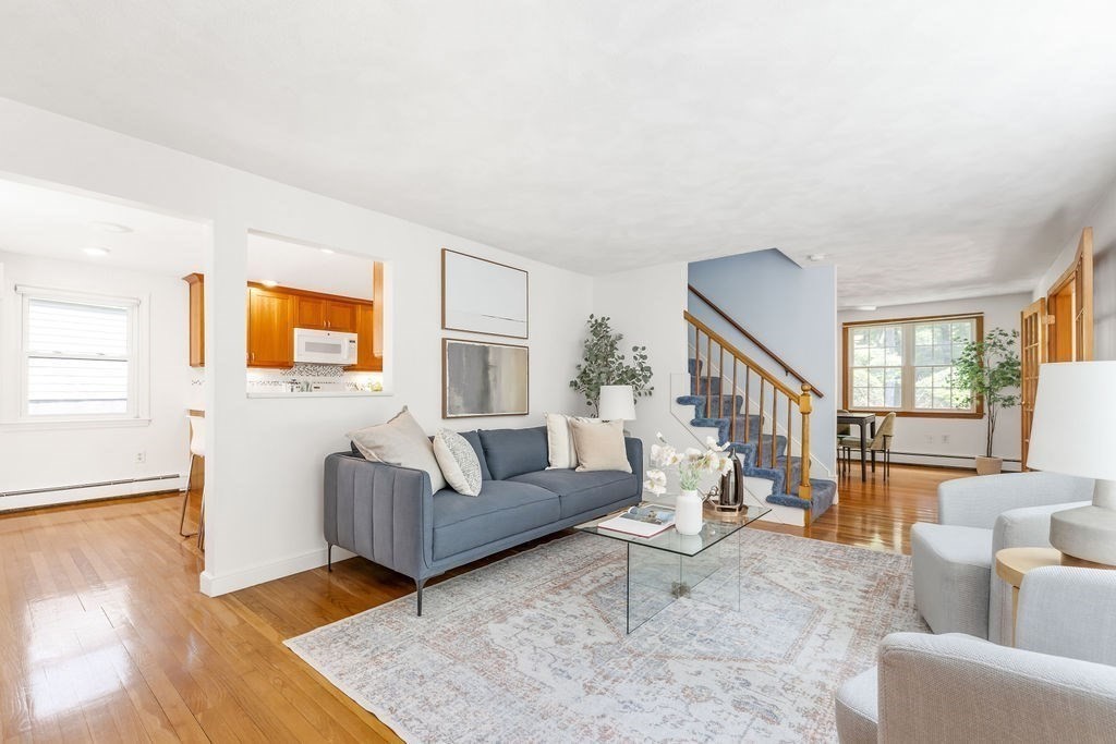 21 Vanderbelt Road Acton, MA 01720 - Photo 5 of 36 a living room with furniture and a wooden floor