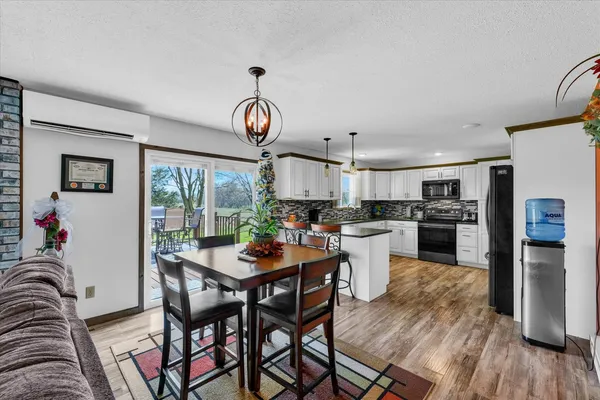 a kitchen with a table and chairs in it