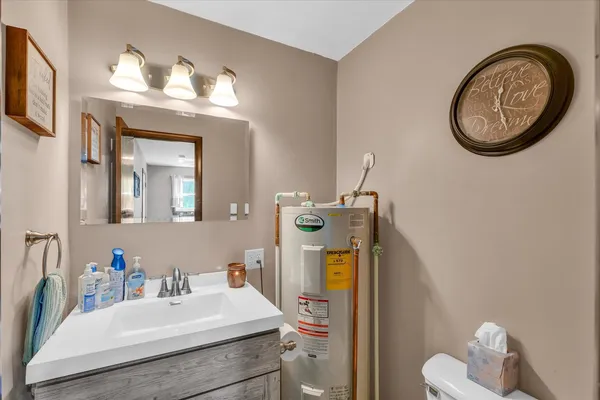 a bathroom with a sink and a mirror