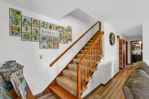 a view of an entryway with wooden floor