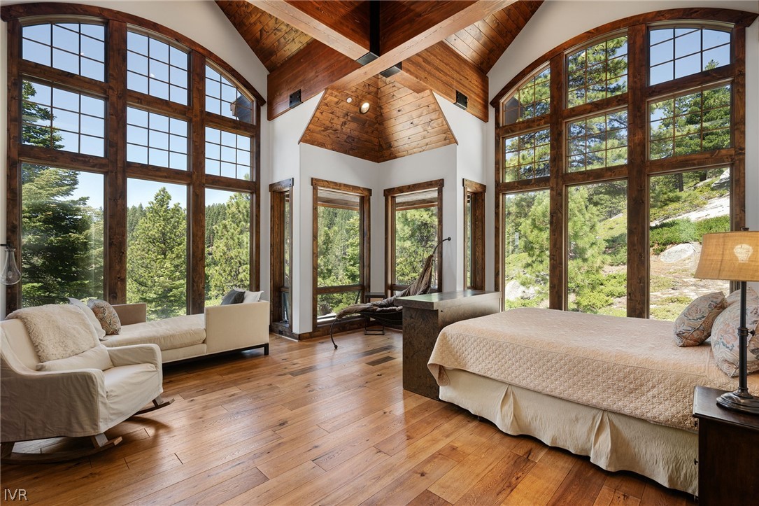 797 Ida Court Incline Village, NV 89451 - Photo 14 of 43 a bedroom with a large bed and a large window