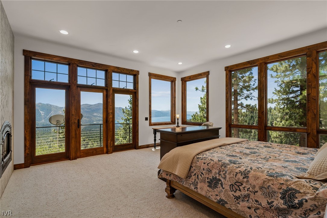 797 Ida Court Incline Village, NV 89451 - Photo 21 of 43 a spacious bedroom with a large bed and a large window