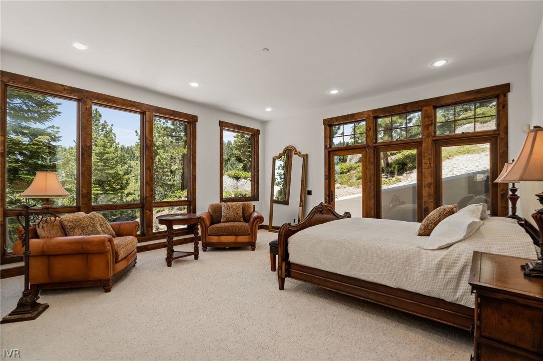 797 Ida Court Incline Village, NV 89451 - Photo 23 of 43 a bedroom with bed couch and a large window