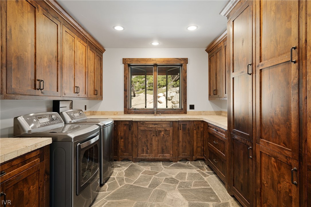 797 Ida Court Incline Village, NV 89451 - Photo 25 of 43 a kitchen with stainless steel appliances granite countertop a sink a stove and a refrigerator