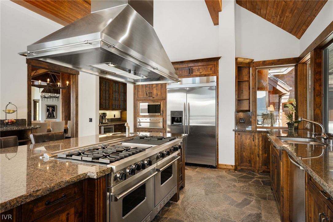 797 Ida Court Incline Village, NV 89451 - Photo 10 of 43 a kitchen with stainless steel appliances granite countertop a stove and a refrigerator