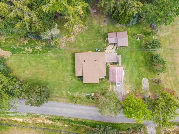 an aerial view of residential house with outdoor space