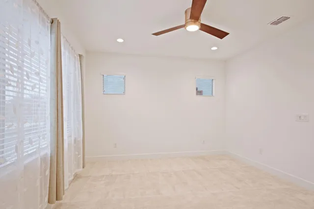 a bathroom with a sink double vanity and a mirror