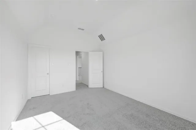 a bathroom with a granite countertop sink a toilet and a mirror