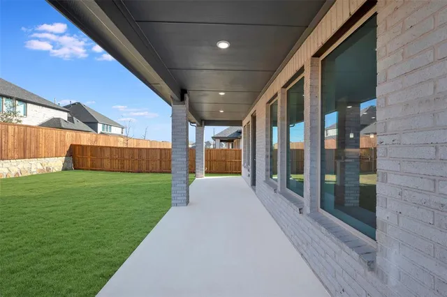 a view of swimming pool with a yard