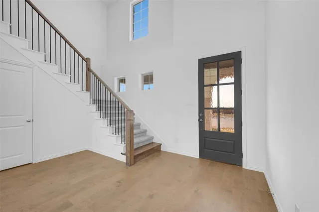 a view of entryway and hall with a front door