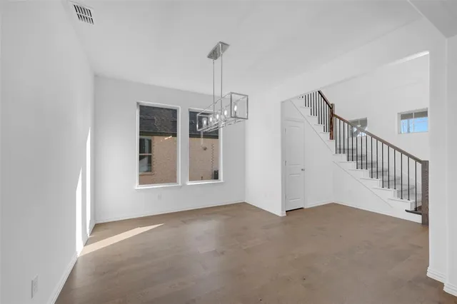 a view of empty room with windows