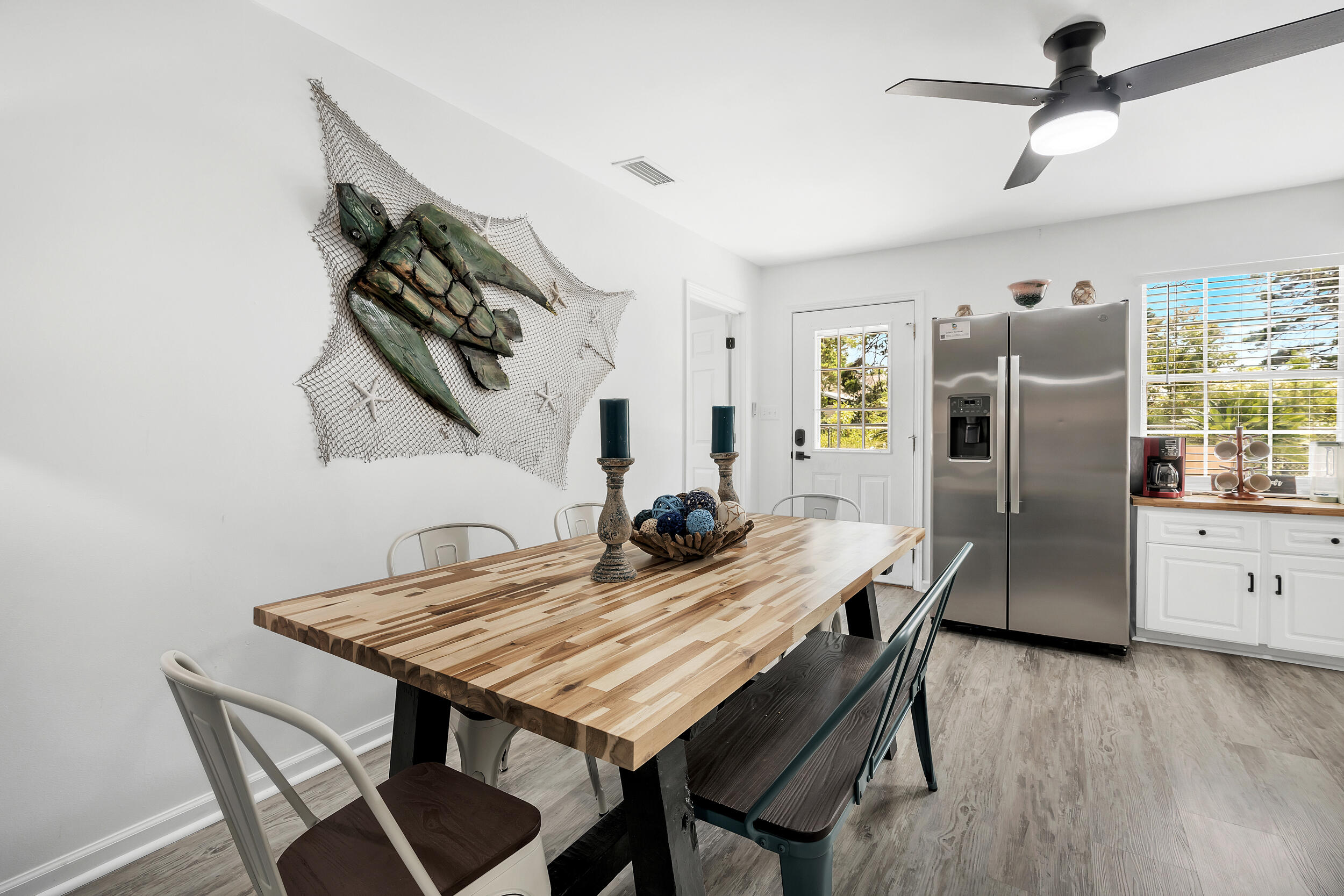 481 North Orange Street Inlet Beach, FL 32461 - Photo 13 of 57 a view of a dining room with furniture and wooden floor