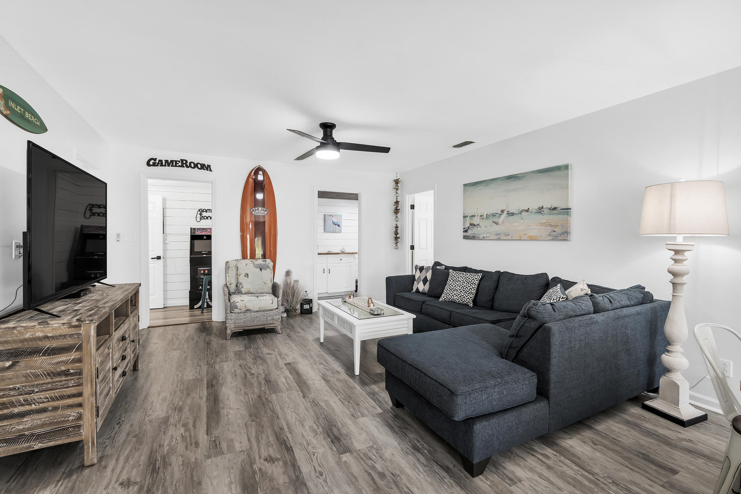 481 North Orange Street Inlet Beach, FL 32461 - Photo 19 of 57 a living room with furniture and a flat screen tv