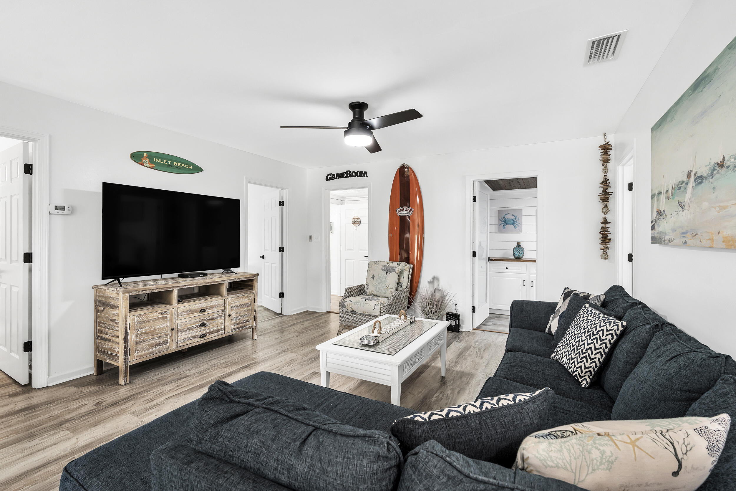 481 North Orange Street Inlet Beach, FL 32461 - Photo 20 of 57 a living room with furniture and a flat screen tv