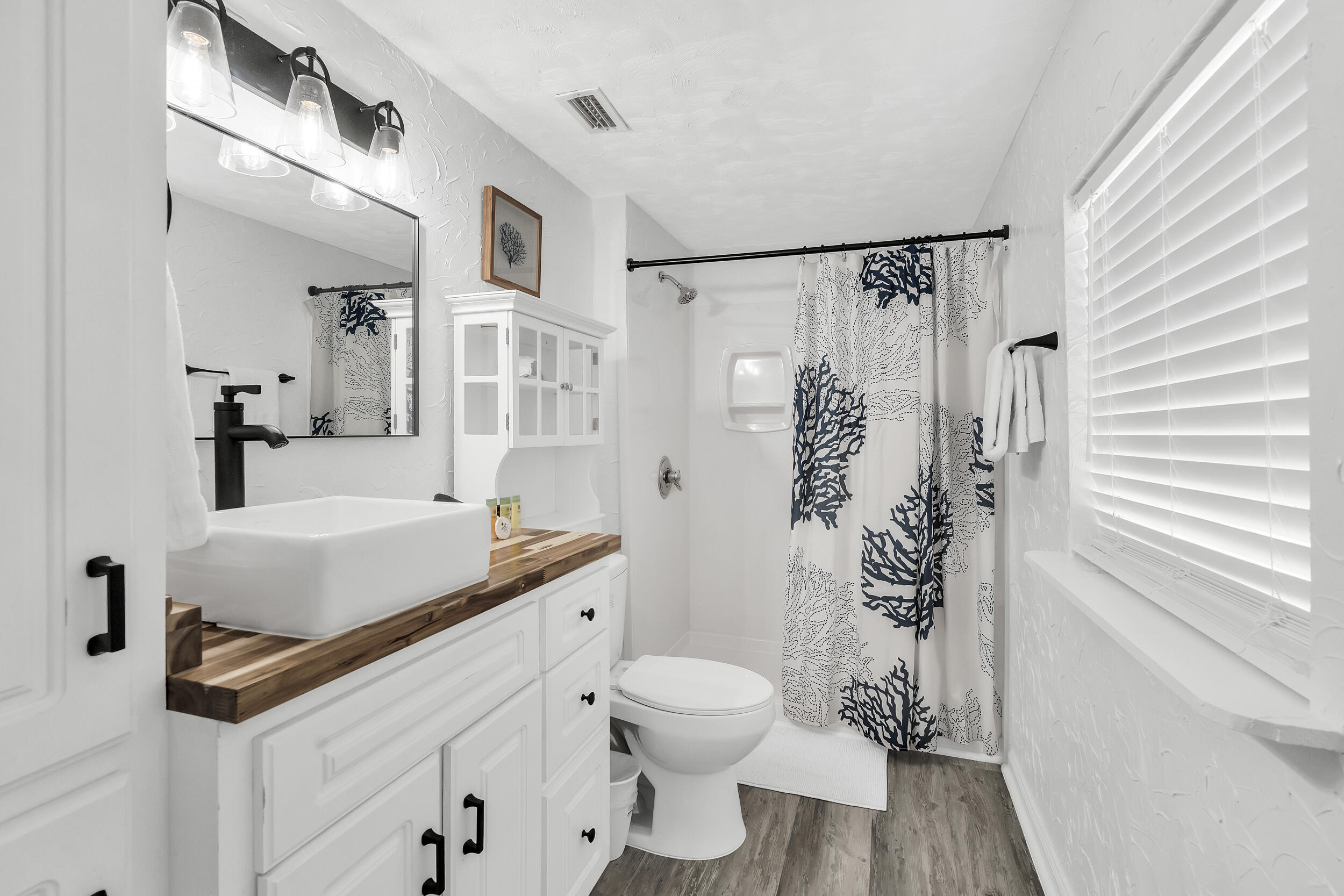 481 North Orange Street Inlet Beach, FL 32461 - Photo 26 of 57 a bathroom with a sink toilet and shower