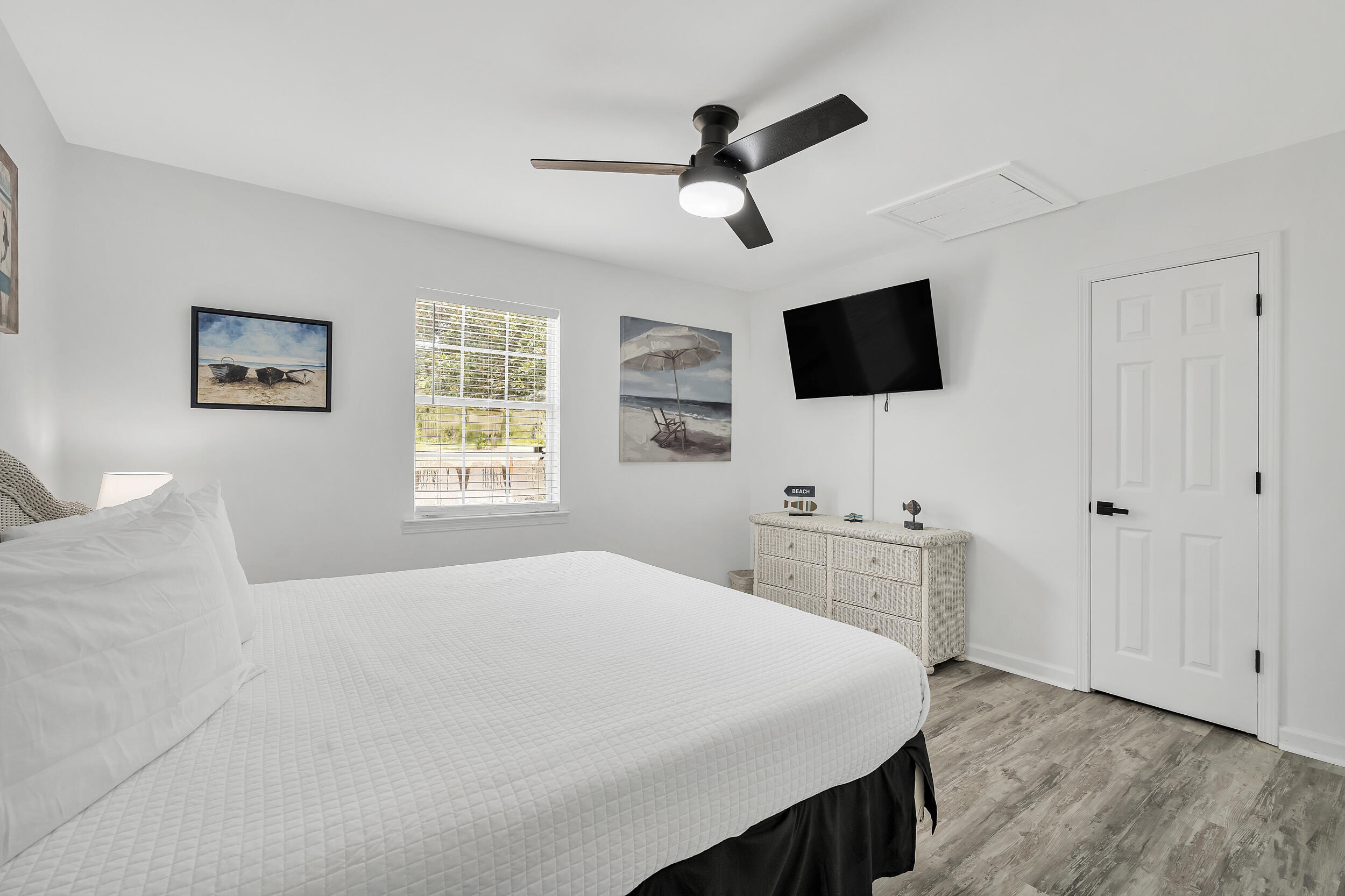 481 North Orange Street Inlet Beach, FL 32461 - Photo 27 of 57 a bedroom with a bed and a flat screen tv
