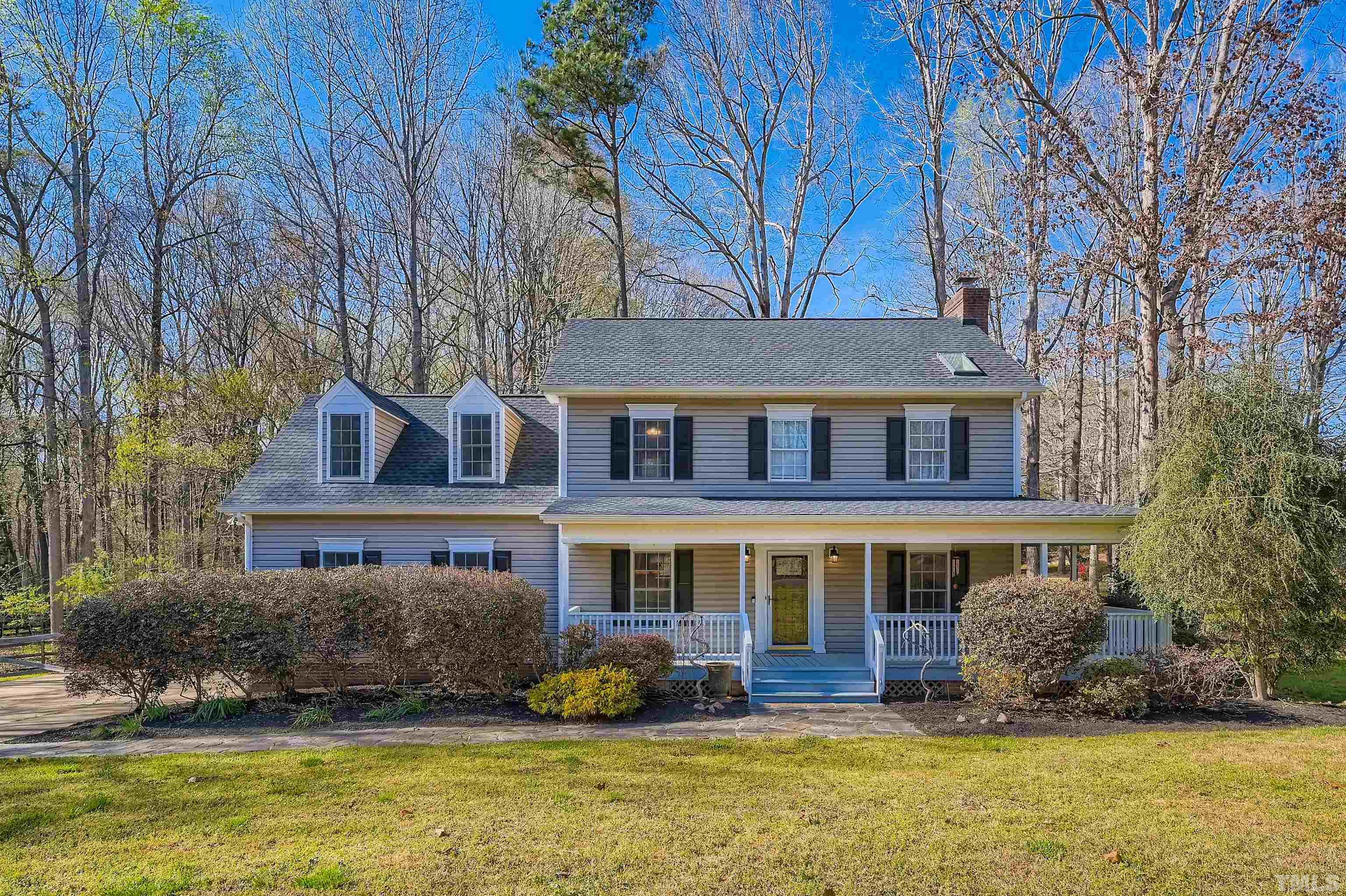 1705 Reynolda Court Raleigh, NC 27603 - Photo 1 of 28 a front view of a house with a yard table and chairs