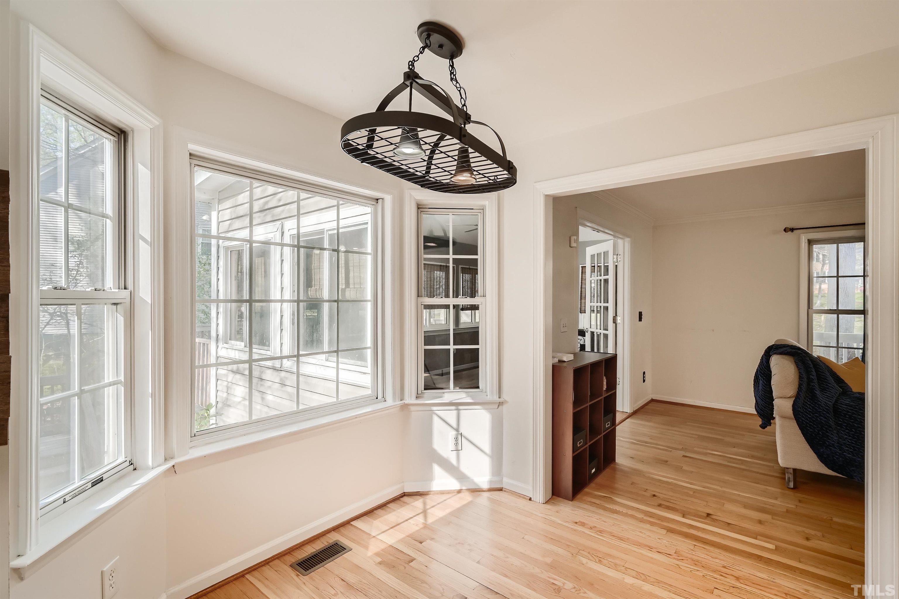 1705 Reynolda Court Raleigh, NC 27603 - Photo 12 of 28 a view of a room with wooden floor and furniture