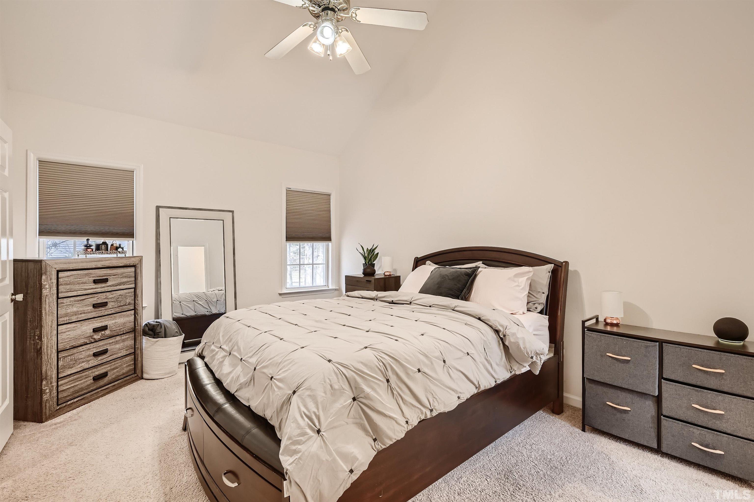 1705 Reynolda Court Raleigh, NC 27603 - Photo 13 of 28 a bedroom with a bed and a tv