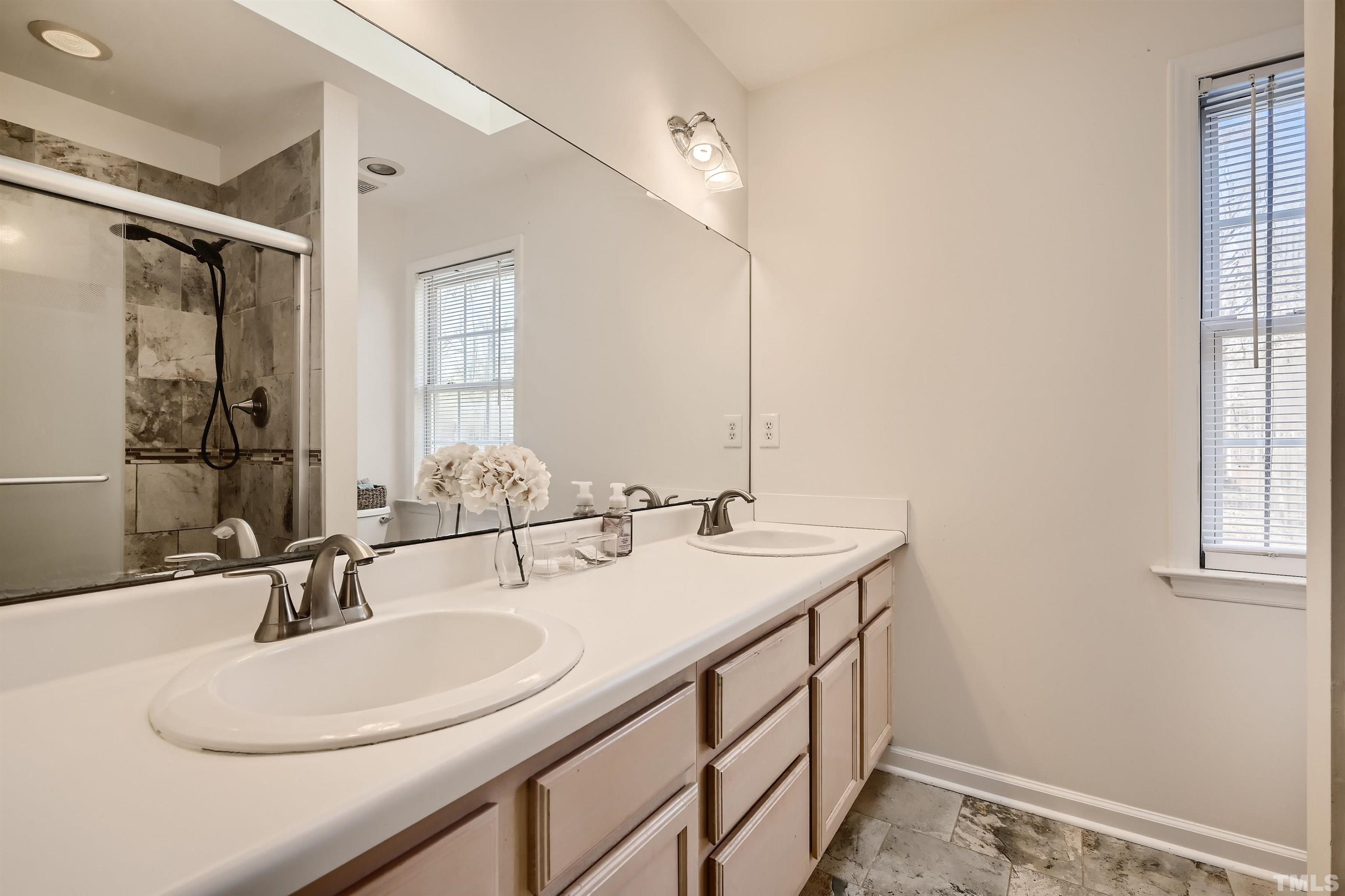 1705 Reynolda Court Raleigh, NC 27603 - Photo 16 of 28 a bathroom with a sink and a mirror