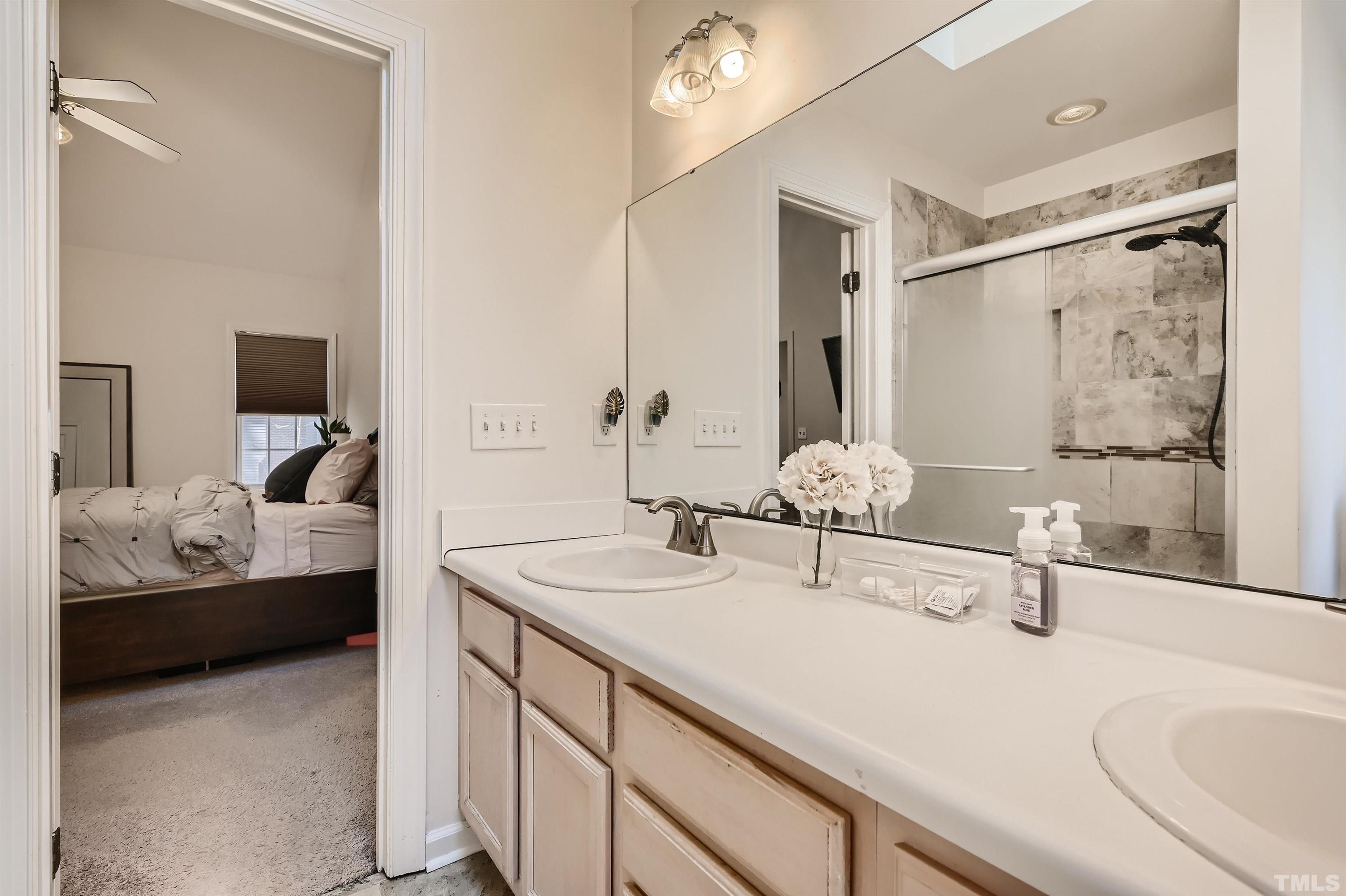 1705 Reynolda Court Raleigh, NC 27603 - Photo 17 of 28 a bathroom with a sink and a mirror