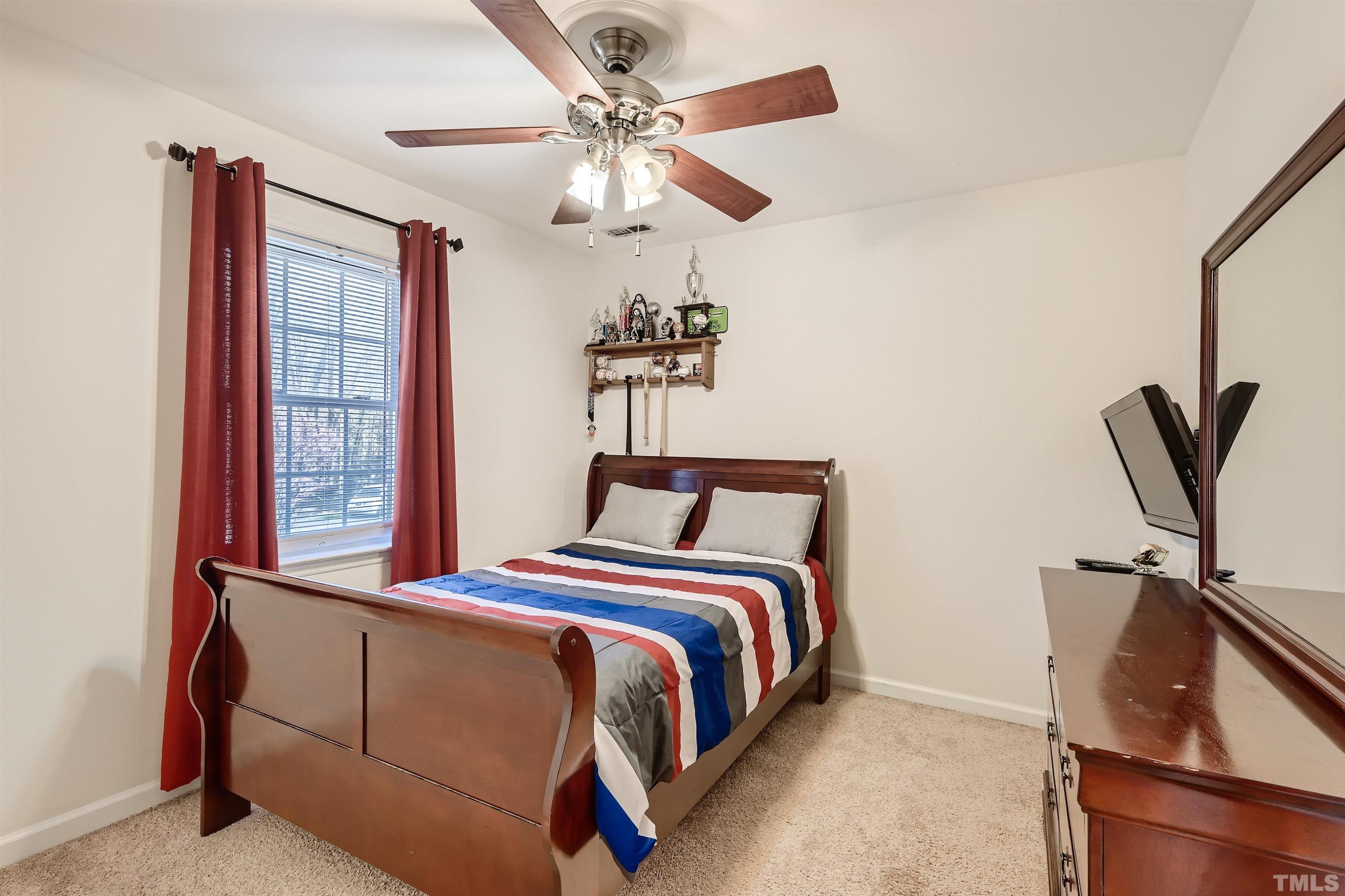 1705 Reynolda Court Raleigh, NC 27603 - Photo 18 of 28 a bedroom with a bed and window