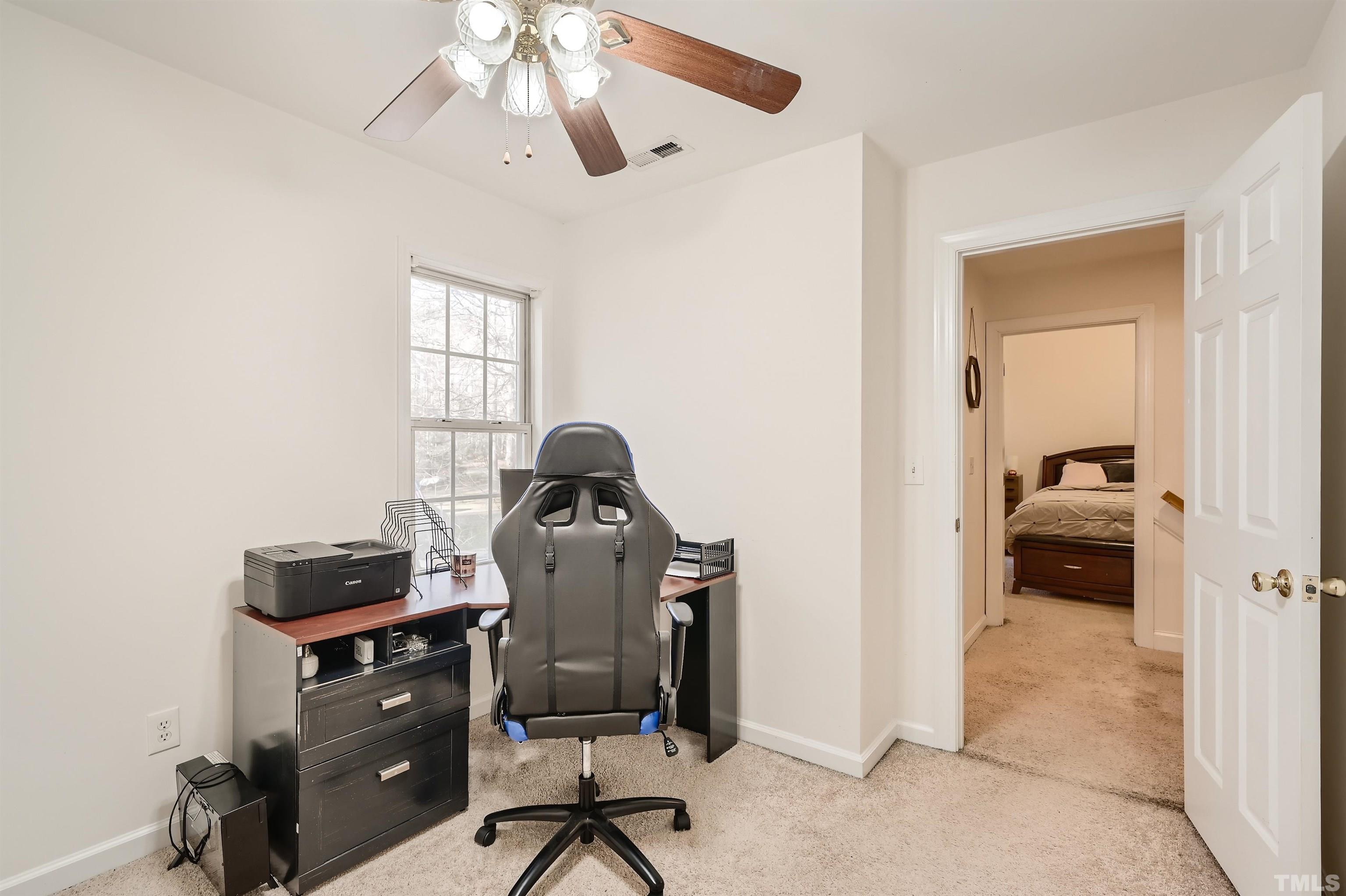 1705 Reynolda Court Raleigh, NC 27603 - Photo 19 of 28 a view of a workspace with furniture and a window