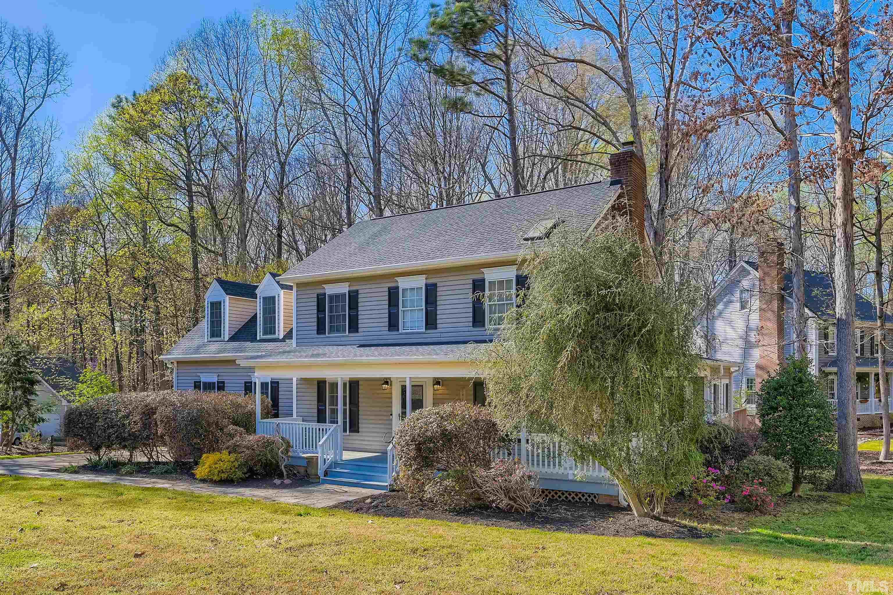 1705 Reynolda Court Raleigh, NC 27603 - Photo 2 of 28 a front view of a house with a garden and swimming pool