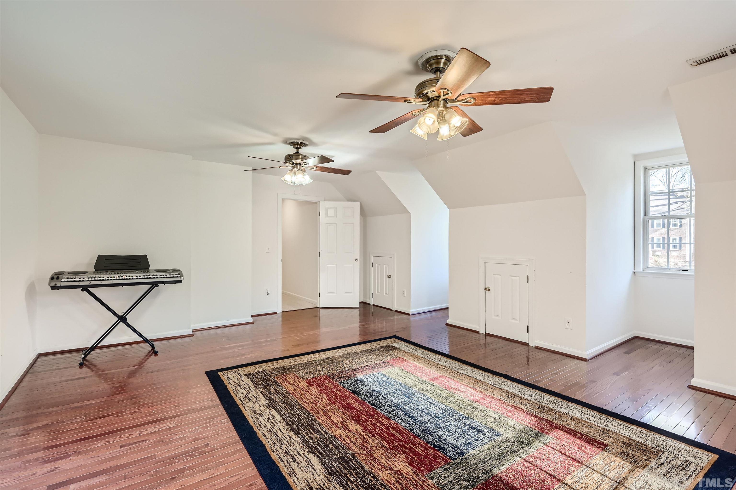 1705 Reynolda Court Raleigh, NC 27603 - Photo 21 of 28 a living room with couch and wooden floor
