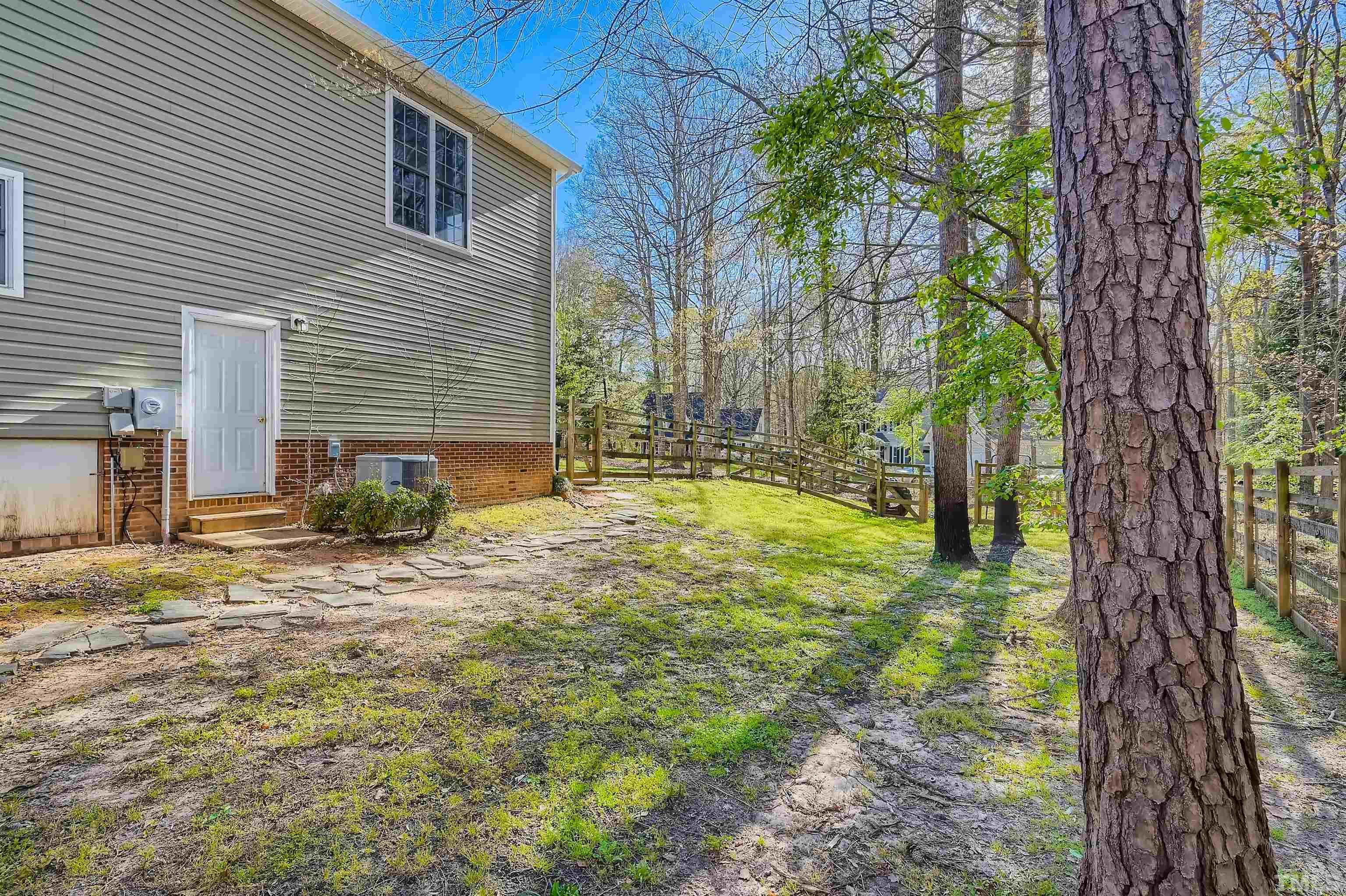 1705 Reynolda Court Raleigh, NC 27603 - Photo 26 of 28 a view of a yard with plants and trees